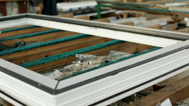Production of pvc windows, on the table lie screws and curtains for PVC windows and screwdriver, manufacturing of frames and windows from plastic profiles, close-up — Stock Footage Production of pvc windows, on the table lie screws and curtains for PVC windows and screwdriver, manufacturing of frames and windows from plastic profiles, close-up Royalty Free Stock Video