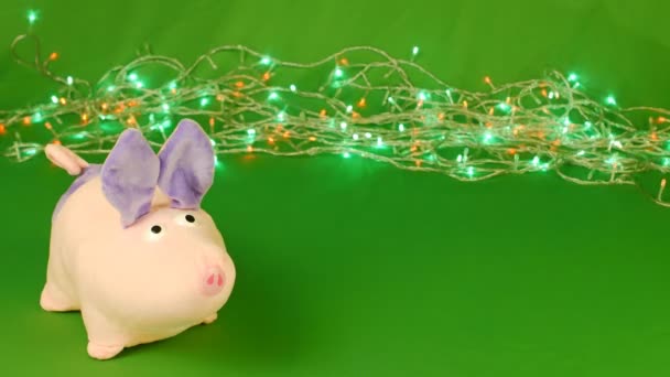 Piggy or mumps and falling Christmas decorations toys taws, New year 2019 on green Chroma key — Stock Video