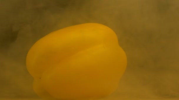 Yellow juicy paprika on a black background, coolness, freshness, close-up, slow motion, vegetable — Stock Video