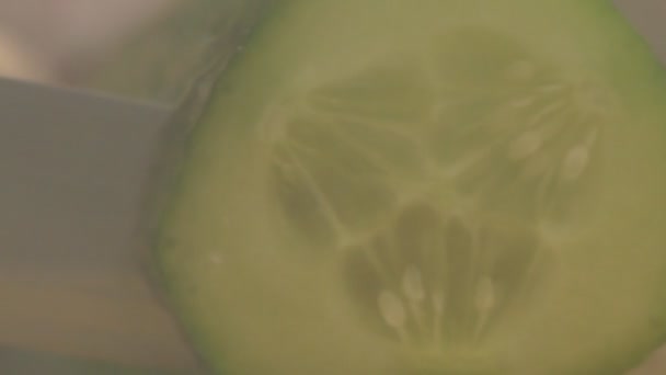 Man Cuts Cucumber Slices Black Background Haze Macro Slow Organic — Stock Video