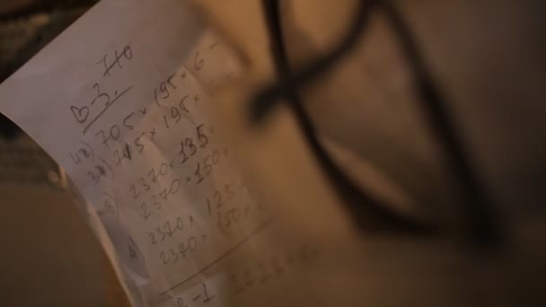 Calculations written on a piece of paper in furniture workshop or premises for wood processing — Stock Video