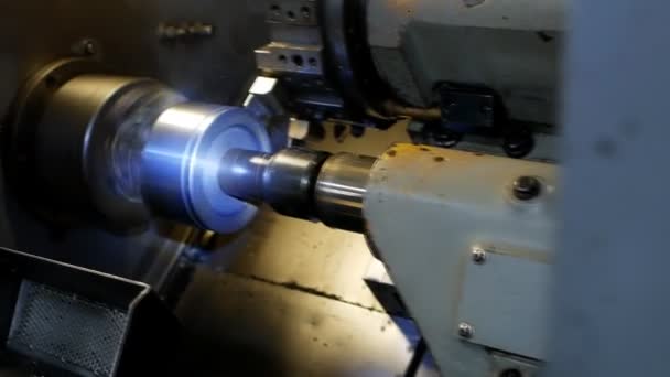 Modern lathe CNC grinds metal part for mechanical engineering, industry, metalworking — Stock Video