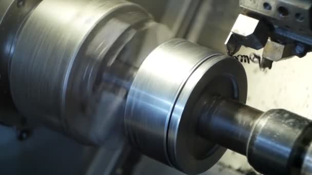 Modern lathe CNC grinds metal part for mechanical engineering, industry, metalworking — Stock Video