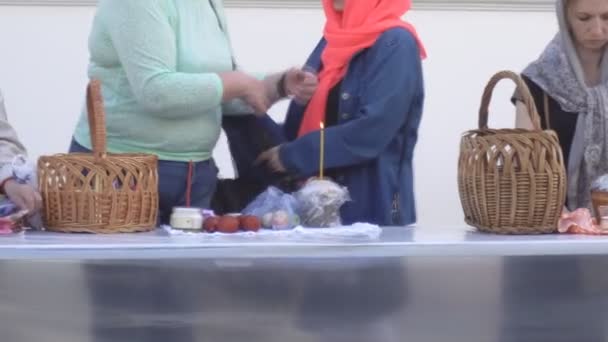 Church holiday Easter, consecration of Easter cakes and eggs in the church, tradition, christian, BOBRUISK, BELARUS - April 27, 2019 — Stock Video