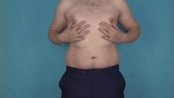 Fat folds and overweight on torso, breast and belly shaking in slow motion. Obesity, graceless body. Plump or thick guy eats a lot of fried foods and drinks beer. Male health, figure and diet. Abdomen — Stock Video