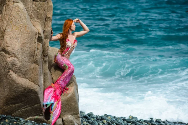 Beautiful mermaid with long tail on sea shore — Stock Photo, Image