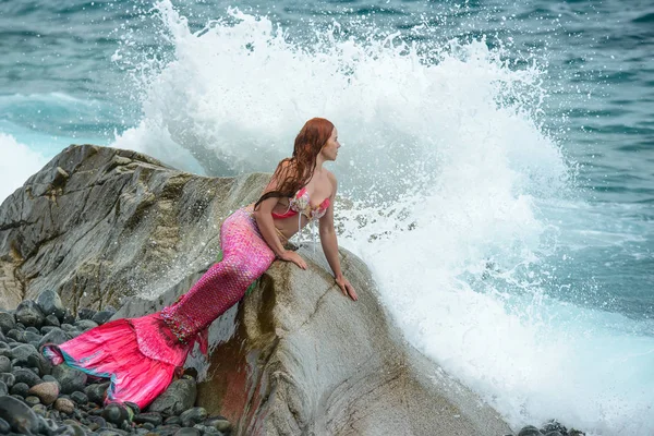 Beautiful mermaid with long tail on sea shore — Stock Photo, Image