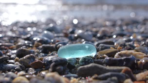 Glass pebbles on beach — Stock Video