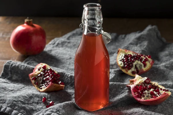 Homemade Sweet Red Pomegranate Grenadine Syrup in a Bottle
