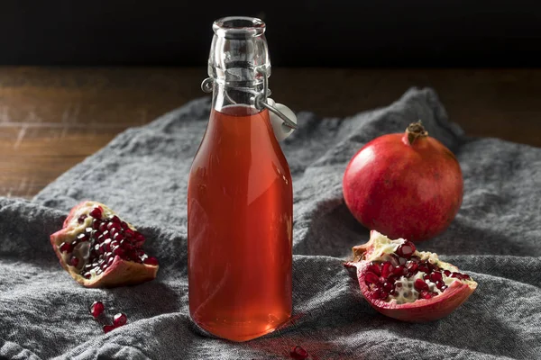 Homemade Sweet Red Pomegranate Grenadine Syrup in a Bottle