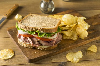 Homemade Roast Beef Deli Sandwich with Lettuce and Tomato clipart