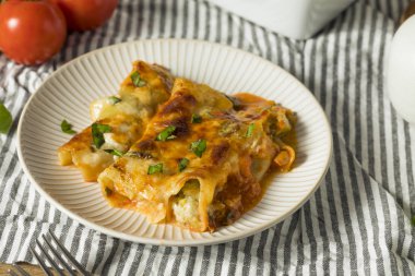 Baked Stuffed Vegetarian Cannelloni with Broccoli Basil and Cheese clipart