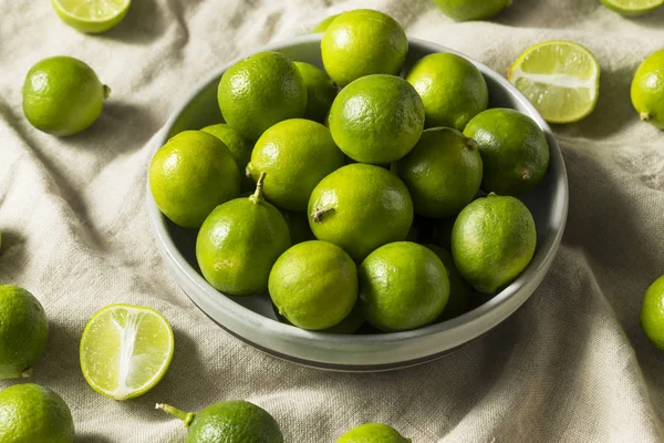 Raw Green Organic Key Limes in a Bowl