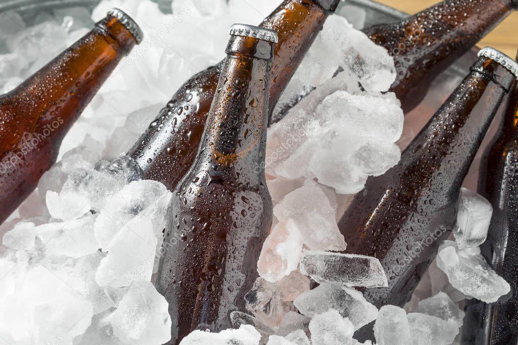 Cold Icy Beer Bottles in a Cooler with Ice