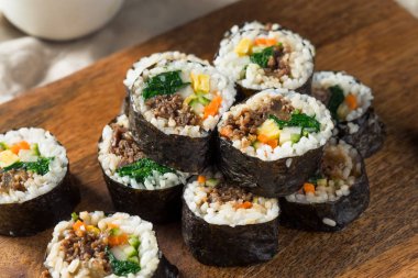 Homemade Korean Kimbap Rice Rolls with Beef and Veggies clipart