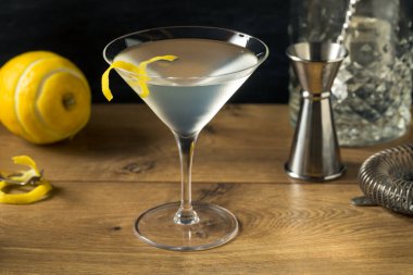 Boozy Refreshing Gin Martini with a Lemon Garnish clipart