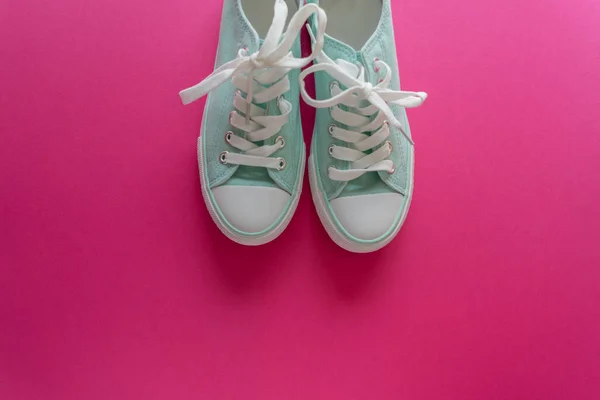 stock image sneakers on pink background
