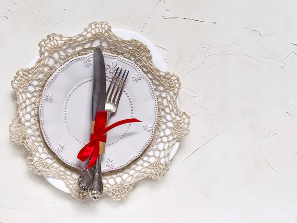 Christmas table setting, menu concept composition, decorated with pine tree branches, spices. Christmas light background, frame made of fir twigs, cones, berries. Flat lay, top view, copy space.