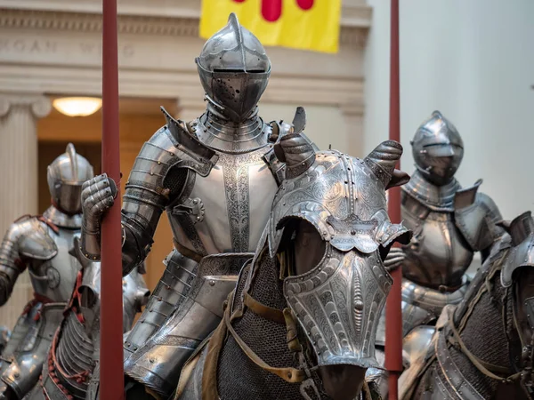 A group of 16th century knights wearing German plate armor around the time of early Renaissance. All appear armed with lances