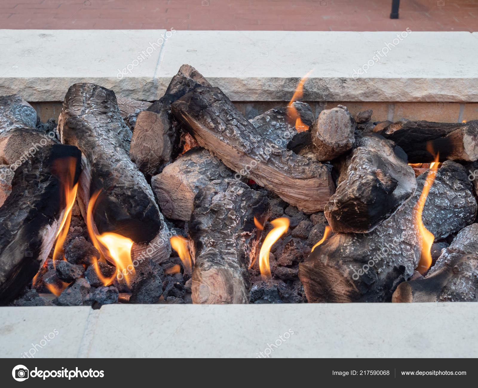 Logs Sitting In Open Fire A White, Open Fire Pit