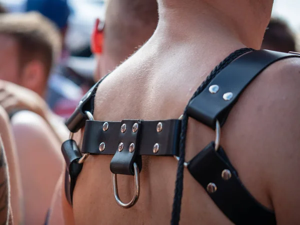 BDSM leather harness on shirtless white male