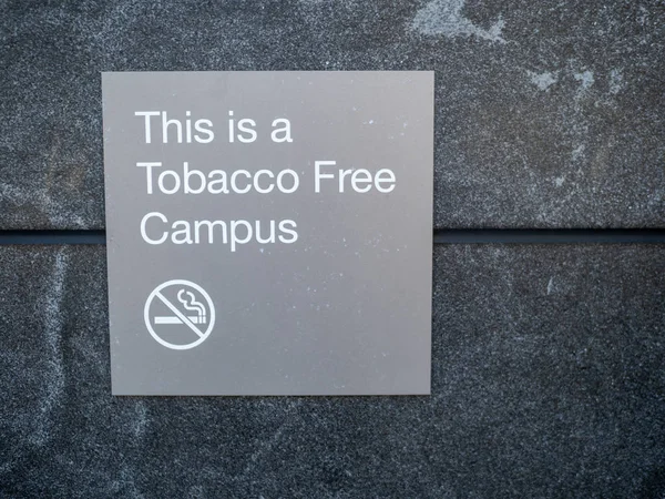 This is a tobacco free campus sign and logo posted outside of building