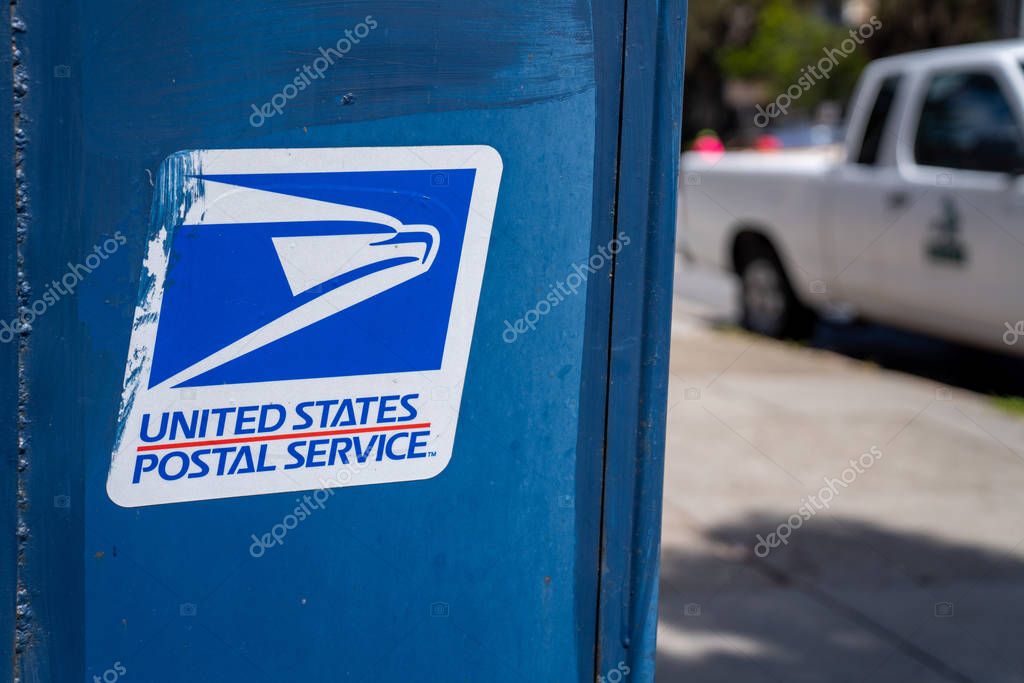 San Francisco, CA MAY 19, 2019: United States Postal Service USPS, logo and on mail box on sidewalk