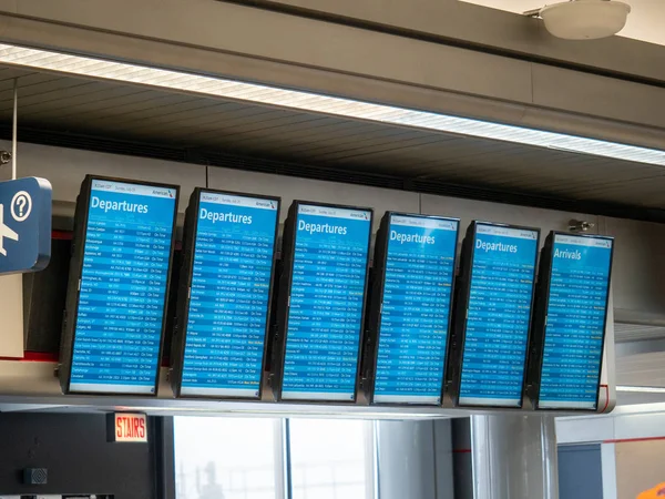 American Airlines departures and arrivals screens at airport — Stock Photo, Image