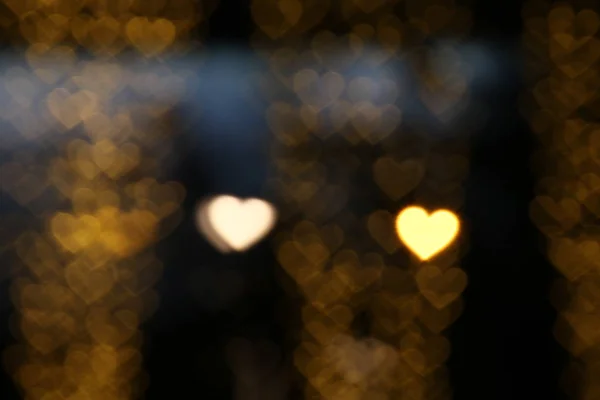 情人节五颜六色的心形在黑色背景照明波克装饰在夜间背景壁纸模糊的情人节 爱的图片背景 照亮心形柔软在夜间抽象 — 图库照片