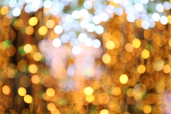 Bokeh 背景金色黄色五颜六色的圣诞快乐 新年快乐博凯照明闪耀在夜晚的背景 Bokeh 闪闪发光的光芒 金色的豪华背景纹理 闪闪发光的壁纸 — 图库照片