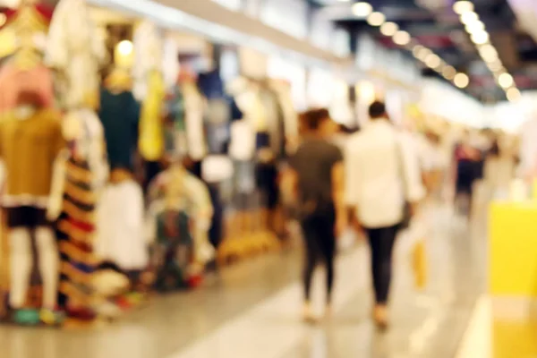 background blurred people in shopping fashion store, blurry images shop inside shopping mall, clothing store fashion blur inside mall