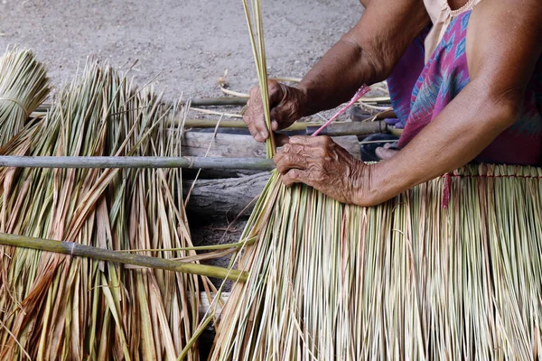 picture shows how to make a panel vetiver for hut roof, handwork crafts of panel vetiver for hut roof, straw roof hut