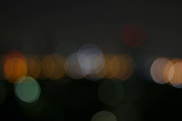 Blurred colorful bokeh for night background, abstract night blur city with bokeh colorful light background, blurry bokeh glowing shiny color background