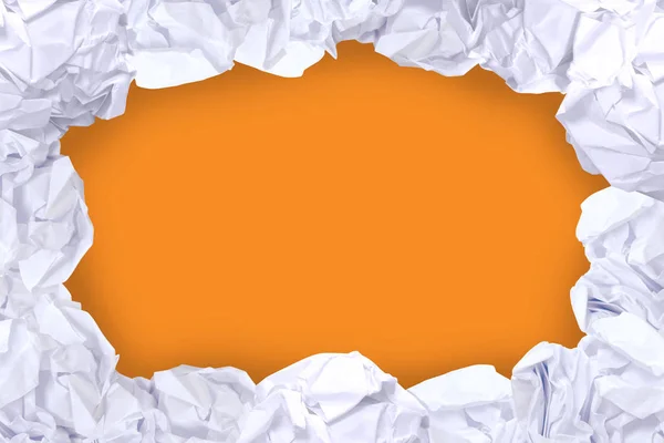 crumpled paper ball white frame on orange color and copy space background, copy space in rough paper waste ball on orange background for white paper ball banner