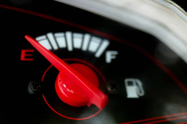 fuel gauge with arrow red indicator level (selective focus)