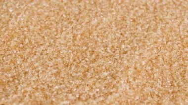 brown sugar crystals, close-up, representing raw food material, sugar industry, dessert, beverage, culinary, nutrition. symbolizing sweetness, risk of diabetes, sugar control, and health awareness
