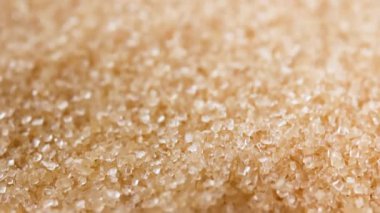 brown sugar crystals, close-up, representing raw food material, sugar industry, dessert, beverage, culinary, nutrition. symbolizing sweetness, risk of diabetes, sugar control, and health awareness