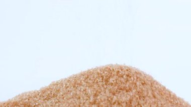 brown sugar crystals, close-up, representing raw food material, sugar industry, dessert, beverage, culinary, nutrition. symbolizing sweetness, risk of diabetes, sugar control, and health awareness
