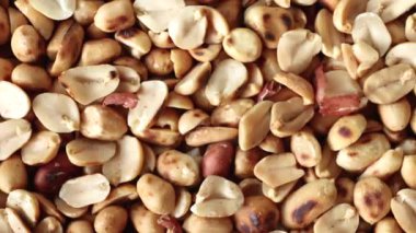 roasted peanuts, showing golden brown peanuts texture, close-up, delicious peanuts snack rich in protein and nutrition, perfect peanuts background