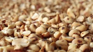 roasted peanuts, showing golden brown peanuts texture, close-up, delicious peanuts snack rich in protein and nutrition, perfect peanuts background