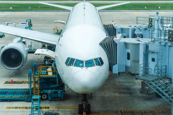 Airplane parked at the airport and preparation for next flight. Aircraft maintenance