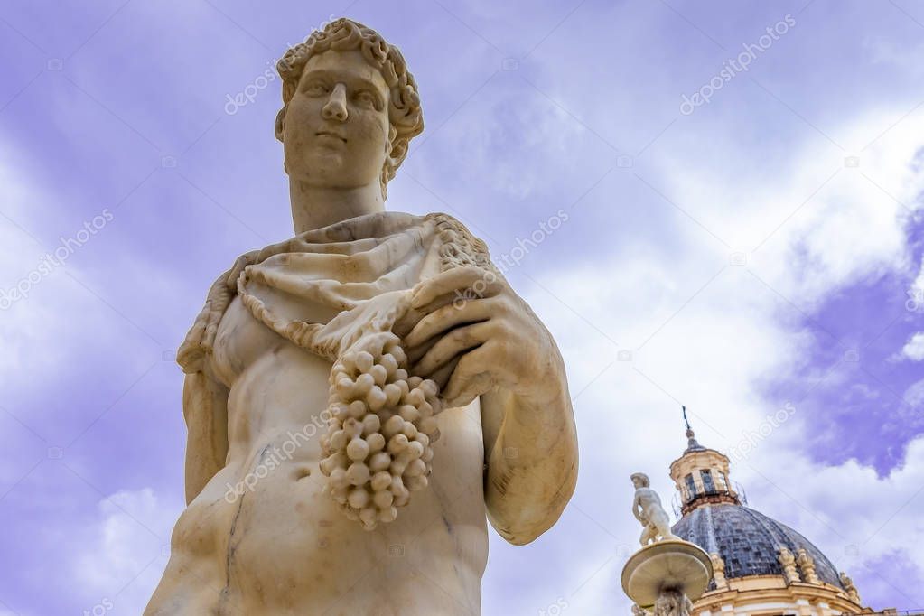 Statue of Dionysus or Bacchus with bunch of grapes