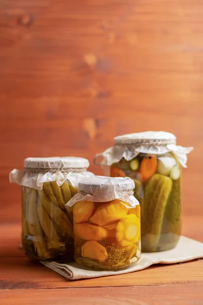 Rustic conservation. Assorted. Small yellow summer squash, okra and cucumbers — Stock Photo, Image
