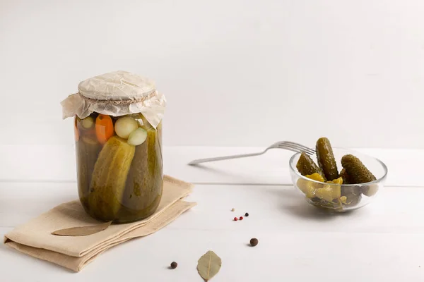 Glass jar with pickled cucumbers on white background — Stock Photo, Image