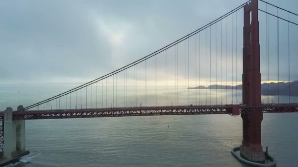 Aerial Sun Rays Piercing Clouds Steady Golden Gate Bridge — Stock Video