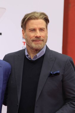 Los Angeles - Aralık 14: John Travolta Pitbull el ve ayak izi töreninde 14 Aralık 2018 üzerinde Tcl Çin Tiyatrosu IMAX Los Angeles, Ca