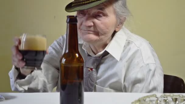 Elderly Woman Drinking Dark Beer — Stock Video