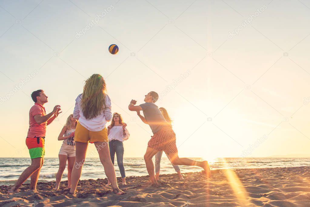 Group of friends enjoy on the beach