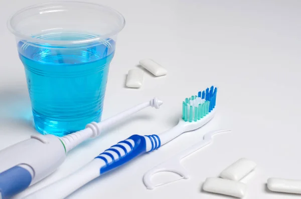 Dental oral irrigator, toothbrush, dental floss, mouthwash, bubb — Stock Photo, Image