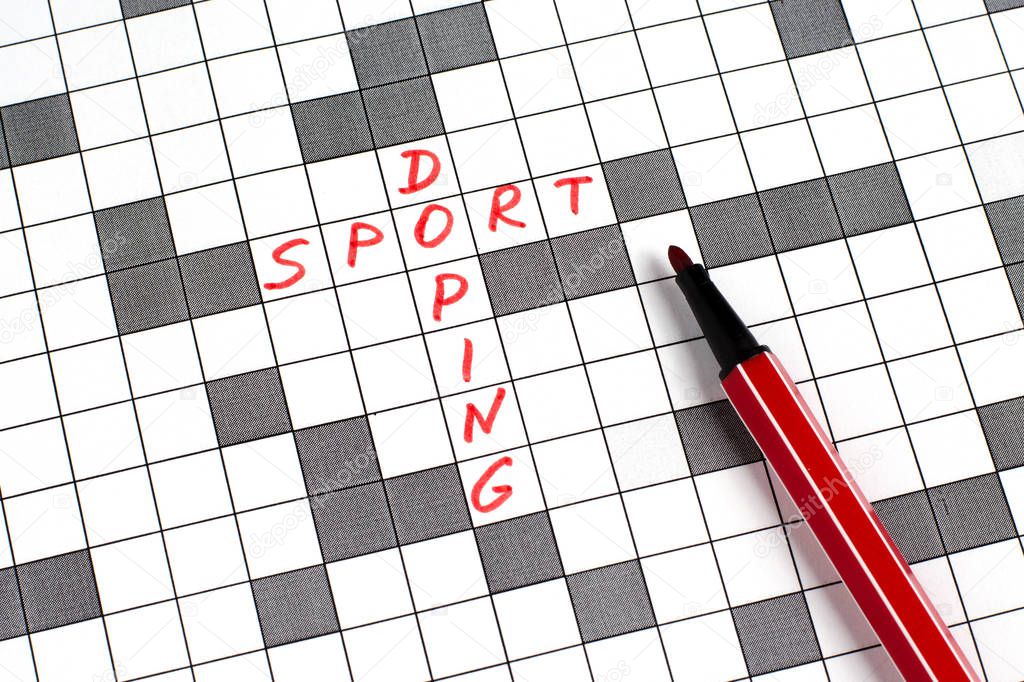 Sport doping. Text in crossword. Red letters. Close-up